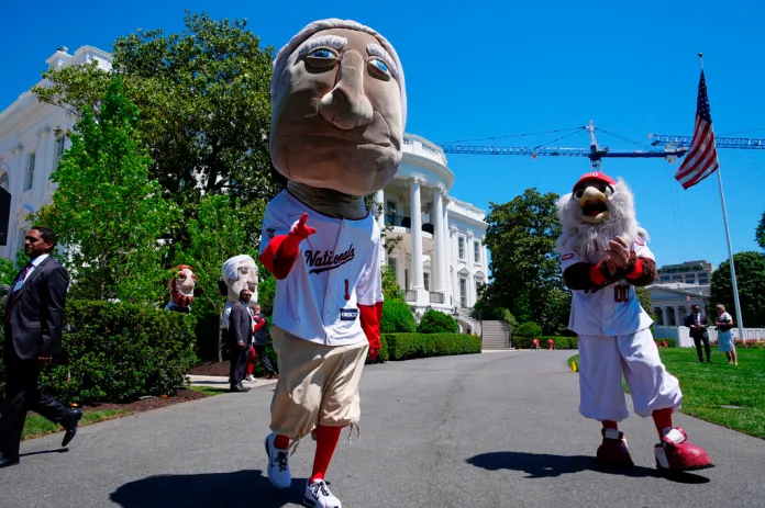 Mascots of the Washington Nationals baseball team, George, and Screech, right, stand near the south lawn of the White House, Tuesday, May 5, 2026, in Washington.