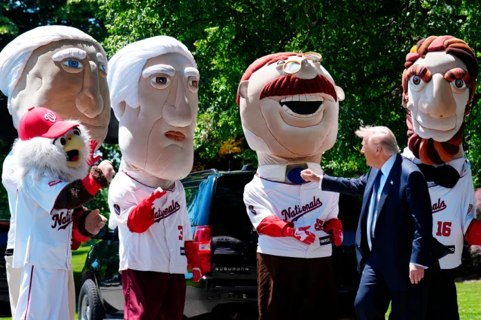 President Donald Trump greets mascots of the Washington Nationals baseball team near the south lawn of the White House, Tuesday, May 5, 2026, in Washington.