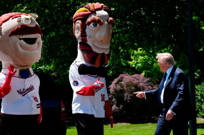 President Donald Trump greets mascots of the Washington Nationals baseball team near the south lawn of the White House, Tuesday, May 5, 2026, in Washington.