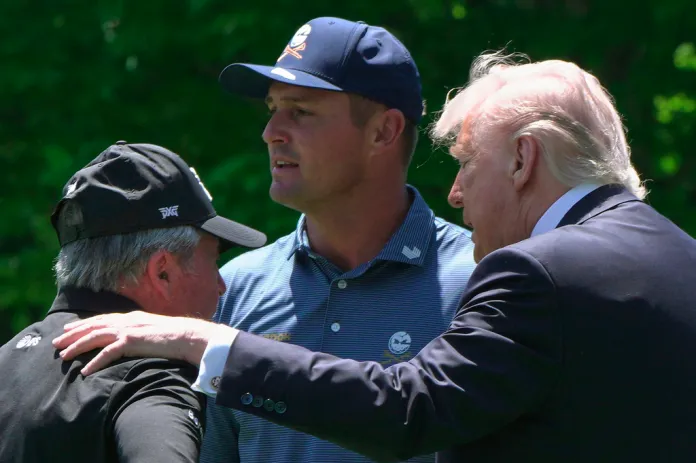 Golfers Bryson DeChambeau, center, and Gary Player speak with President Donald Trump on the south lawn of the White House, Tuesday, May 5, 2026, in Washington.