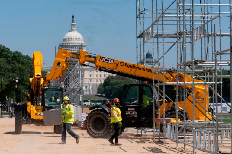 Workers begin construction on the National Mall for the Great American State Fair, part of the America 250 anniversary celebration, in Washington, Tuesday, May 5, 2026.