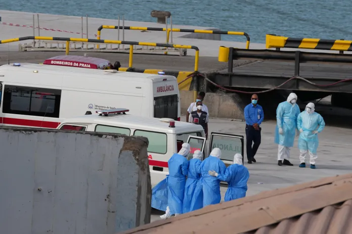 Health workers in protective gear evacuate patients from the MV Hondius cruise ship