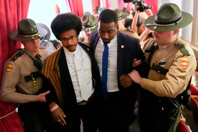 Rep. Justin J. Pearson, D-Memphis, second from left, walks with his brother KeShaun Pearson, as he is arrested and removed from the House gallery during a special session of the state legislature to redraw U.S. Congressional voting maps Thursday, May 7, 2026, in Nashville, Tenn.