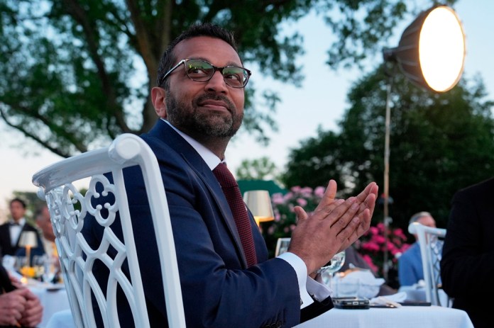 FBI Director Kash Patel listens as President Donald Trump speaks at a dinner for members of his administration and law enforcement organization leaders, during National Police Week, in the White House Rose Garden, Monday, May 11, 2026, in Washington.