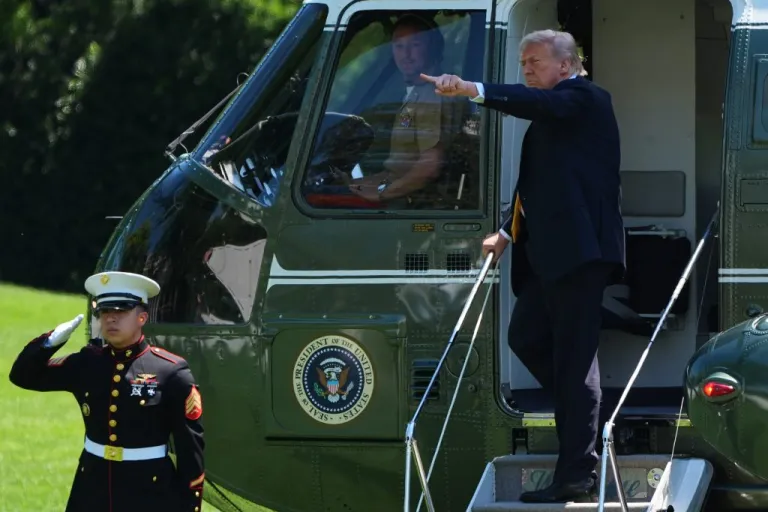 President Donald Trump boards Marine One as he departs the White House for travel to Beijing,