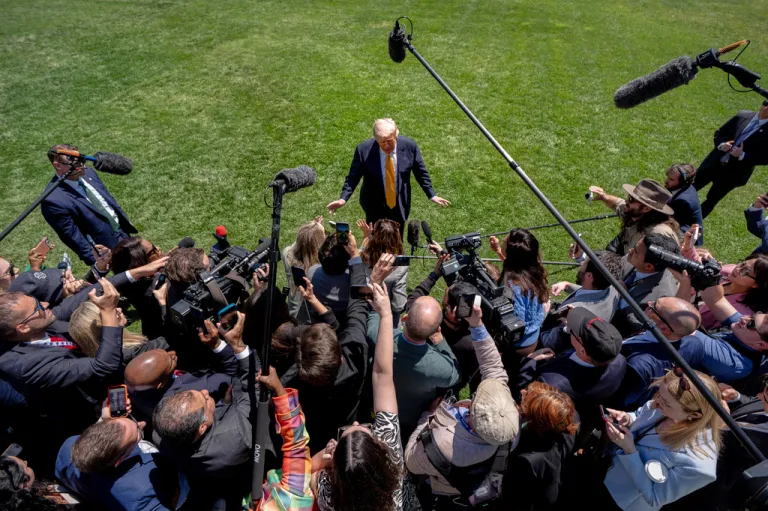 President Donald Trump speaks with reporters.