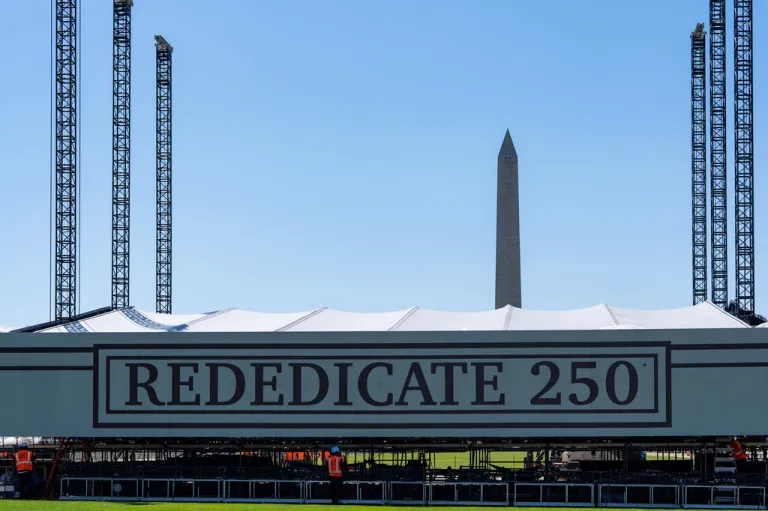 Work continues on the stage for the Rededicate 250 celebration on the National Mall, Tuesday, May 12, 2026, in Washington.