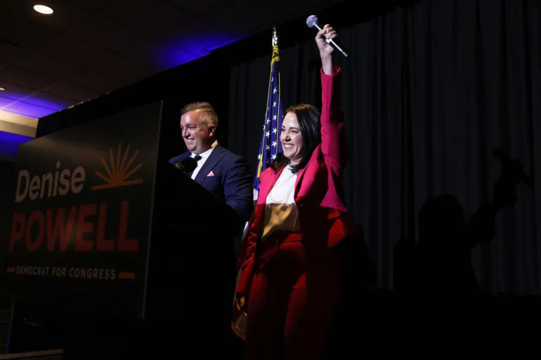 Denise Powell, right, candidate for the Democratic nomination to the House of Representatives in Nebraska's second district, cheers during an election night watch party Tuesday, May 12, 2026, in Omaha, Neb.