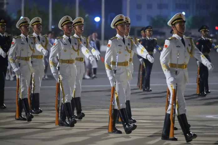 An honor guards moves into place for an arrival ceremony as President Donald Trump arrives on Air Force One, Wednesday, May 13, 2026, at Beijing Capital International Airport in Beijing. (AP Photo/Mark Schiefelbein)
