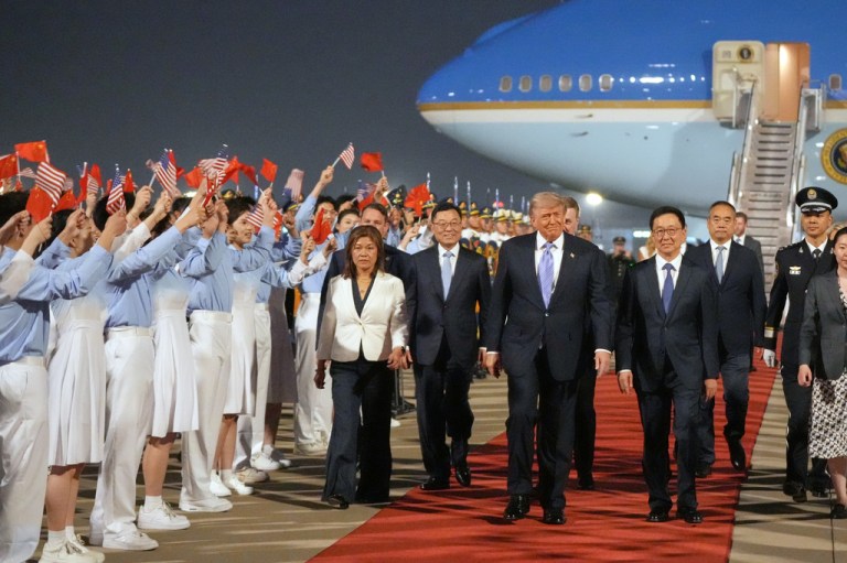 President Donald Trump walks with Chinese Vice President Han Zheng during a welcome ceremony in Beijing on May 13, 2026.