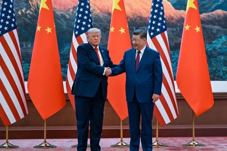 Chinese President Xi Jinping, right, shakes hands with U.S. President Donald Trump at the Great Hall of the People in Beijing, Thursday, May 14, 2026.