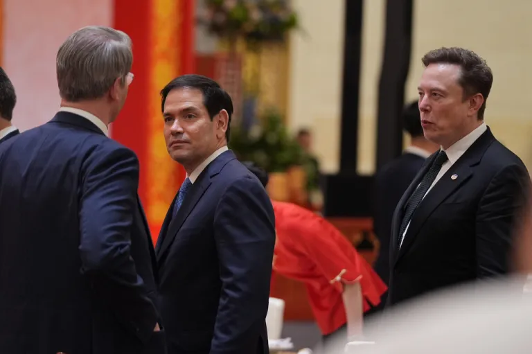 Secretary of State Marco Rubio, center, and Elon Musk, right