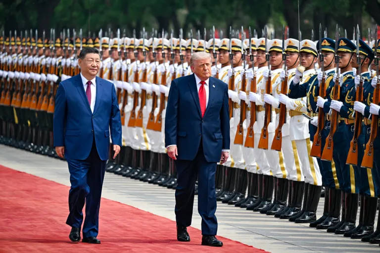 President Donald Trump reviews troops with China's President Xi Jinping