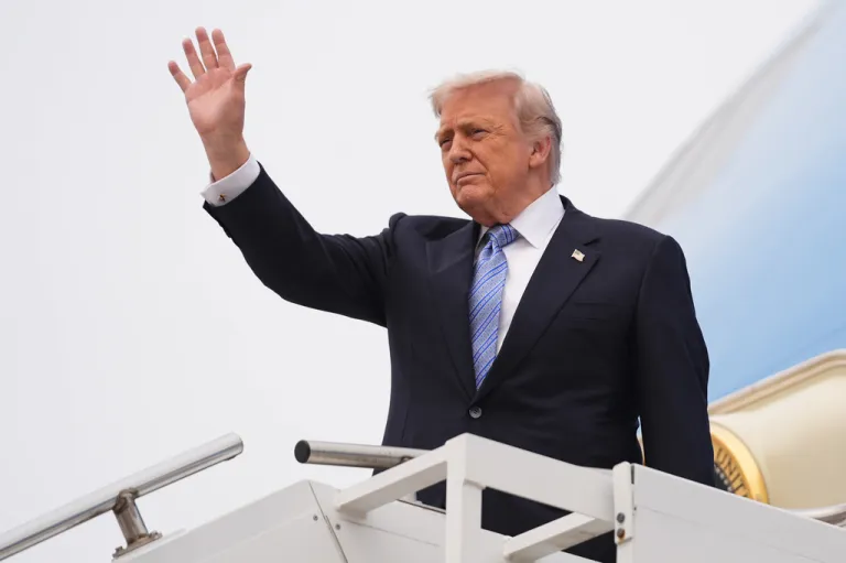 President Donald Trump waves as he boards Air Force One, Friday, May 15, 2026, at Beijing Capital International Airport in Beijing. (AP Photo/Mark Schiefelbein)