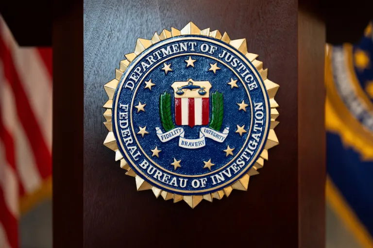 An FBI seal is displayed on a podium before a news conference at the field office in Portland, Ore., Jan. 16, 2025.