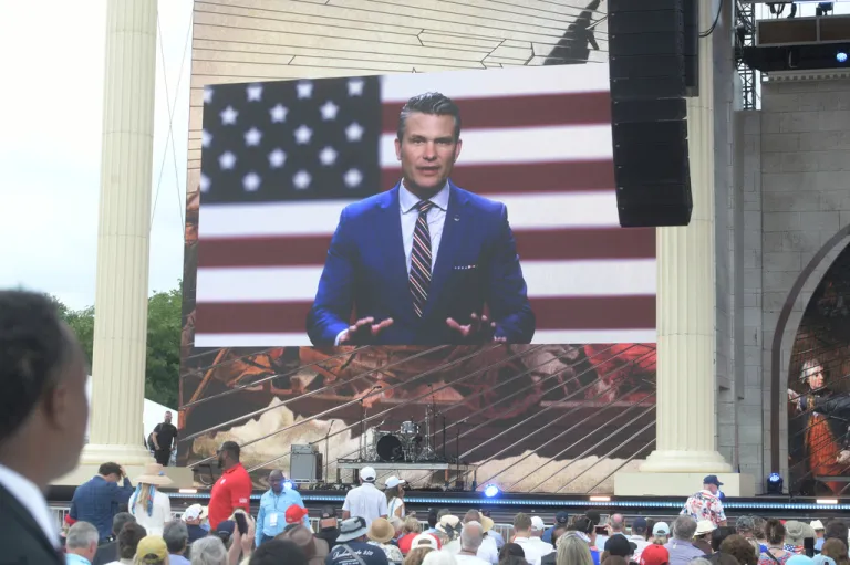 Defense Secretary Pete Hegseth speaks on screen during the Rededicate 250: A National Jubilee Of Prayer, Praise & Thanksgiving, Sunday, May 17, 2026, in Washington. (AP Photo/Rod Lamkey, Jr.)