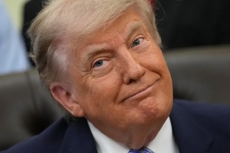 President Donald Trump attends an event about loosening a federal refrigerant rule