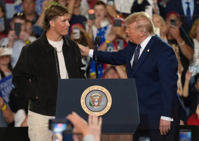 NFL quarterback Jaxson Dart, with the New York Giants, left, introduces President Donald Trump during a Fighting For American Workers event, Friday, May 22, 2026, in Suffern, N.Y. (AP Photo/Ryan Murphy)