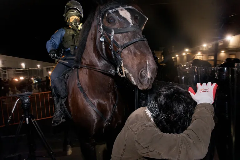 A mounted state trooper faces a protester outside the Delaney Hall detention center during a protest against the transfer of detainees and federal immigration policies, Friday, May 29, 2026, in Newark, N.J. (AP Photo/Andres Kudacki)