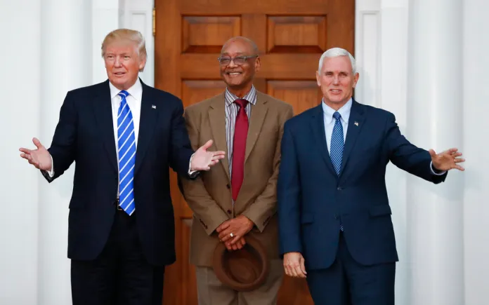 President-elect Donald Trump and Vice President-elect Mike Pence pause for photographs with Center for Neighborhood Enterprises President Bob Woodson