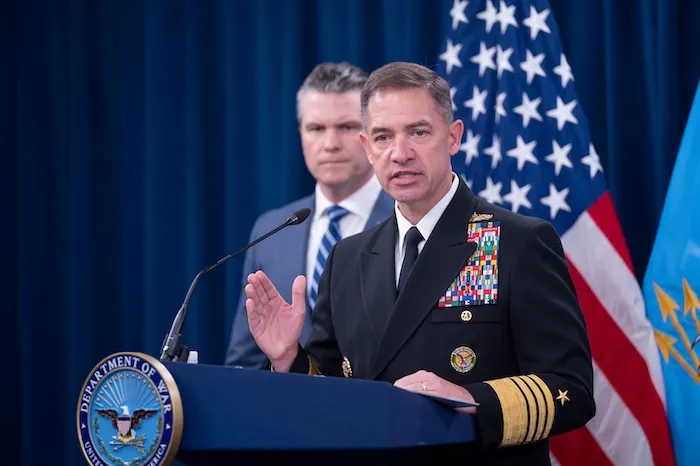 Adm. Brad Cooper speaks to members of the media during a press briefing with Defense Secretary Pete Hegseth, left, at the Pentagon, Thursday, April 16, 2026 in Washington. (AP Photo/Kevin Wolf)