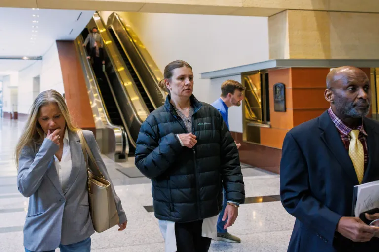 FILE - Aimee Bock, founder and executive director of the nonprofit organization Feeding Our Future, arrives at the Minneapolis federal courthouse with her attorney, Ken Udoibok, right, on March 19, 2025, in Minneapolis. (Kerem Yücel/Minnesota Public Radio via AP, File)