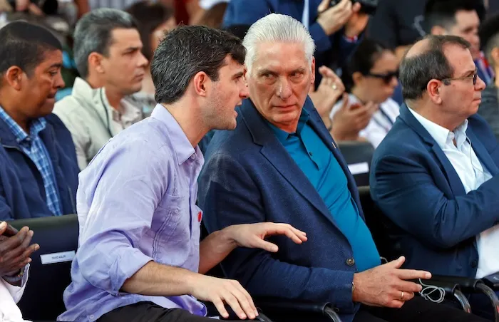 Cuban President Miguel Diaz-Canel, right center, and David Adler, general coordinator of the 