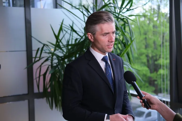 Kęstutis Budrys speaks into a microphone