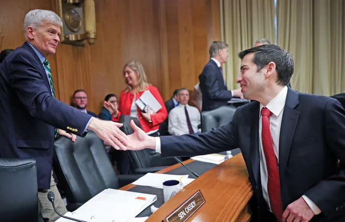 Then-nominee for Deputy Secretary of Labor Keith Sonderling, right, greets Sen. Bill Cassidy (R-LA) before a confirmation hearing, Feb. 27, 2025. (Win McNamee/Getty)