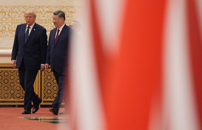 President Donald Trump and Chinese President Xi Jinping arrive during a state dinner at the Great Hall of the People on May 14 in Beijing. (Mark Schiefelbein/AP)