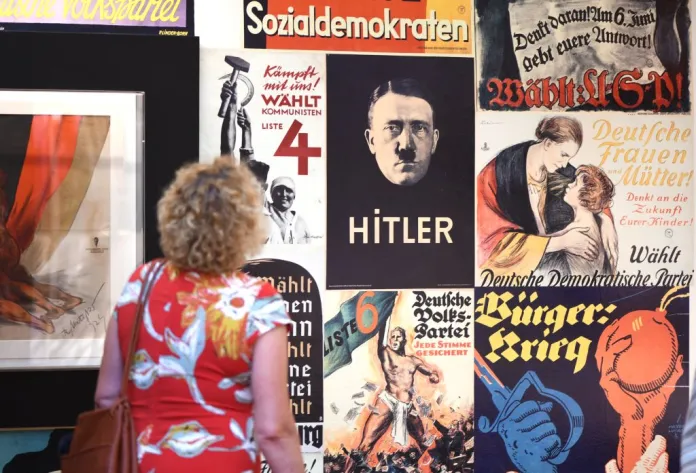 During a tour of the press, a woman visits the exhibition in the House of the Weimar Republic, which will be opened on 31 July as a central memorial to the first German democracy. On 31 July 1919, the National Assembly passed the Weimar Reich Constitution, which was signed by Reich President Friedrich Ebert (SPD) on 11 August in Schwarzburg, Thuringia. Photo: Martin Schutt/dpa-Zentralbild/dpa (Photo by Martin Schutt/picture alliance via Getty Images)