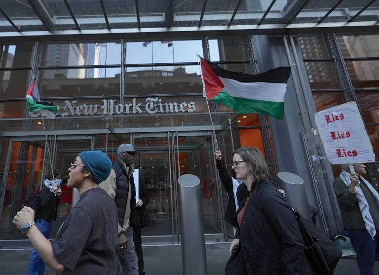 Pro-Palestine activists rally outside the New York Times building to protest the newspaperâs coverage of Israelâs war in Gaza and Iran in New York City, United States, on March 09, 2026. Demonstrators call for a boycott of the newspaper and accuse the publication of spreading misinformation about Gaza and portraying Israelâs military operations in a favorable manner. (Photo by Selcuk Acar/Anadolu via Getty Images)