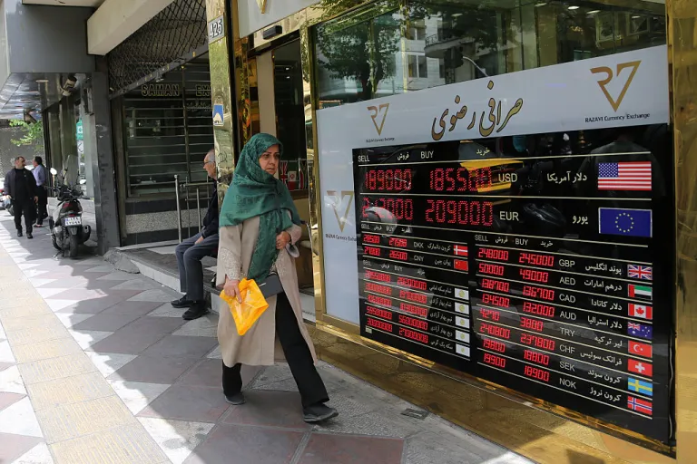 Citizens of Iran are seen as the US dollar hits an all-time high on the open market as the national currency continues to depreciate sharply under the impact of heavy US sanctions and war-driven economic pressures, driving up prices of essential goods and affecting commercial activity across the country, on May 4, 2026, in Tehran, Iran. (Photo by Fatemeh Bahrami/Anadolu via Getty Images)