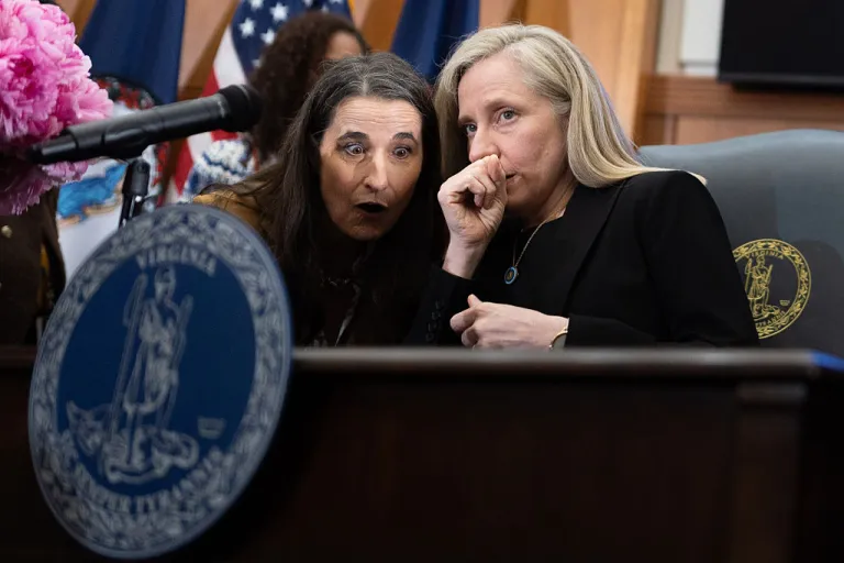 Gov. Abigail Spanberger speaks to Sen. Jennifer Boysko, D-Fairfax, before signing a bill that will create a paid family and medical leave program, Richmond, Va., Monday, May 11, 2026. (Mike Kropf/Richmond Times-Dispatch via Getty Images)