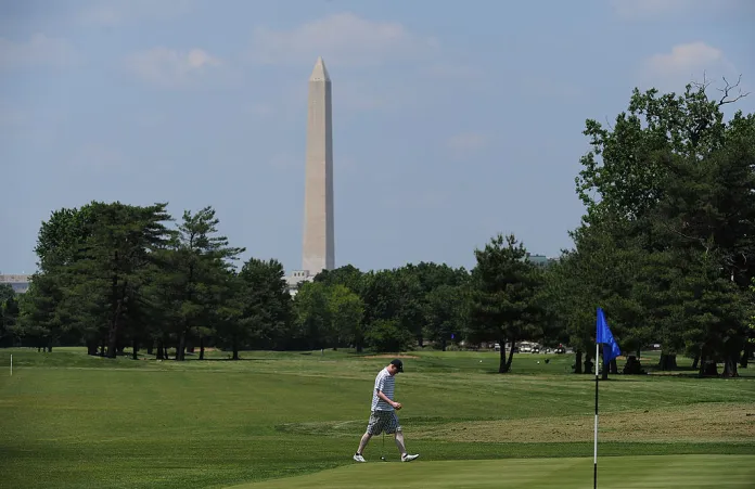 A golfer playing on the greens at East Potomac Park Golf Course.