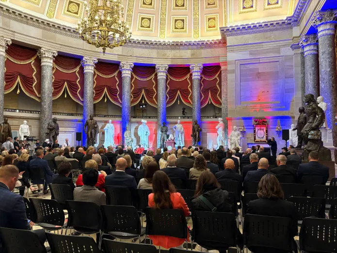 Wide shot view of Kathy Branzell, President of the National Day of Prayer Task Force, giving remarks to the audience in the National Statuary Hall in the Capitol.  (Emily Robertson/Washington Examiner)