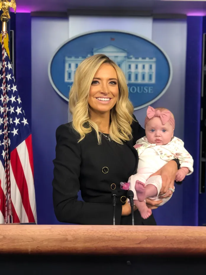 Former White House press secretary Kayleigh McEnany poses with her newborn child during a press conference. (Photo Credit: Kayleigh McEnany)