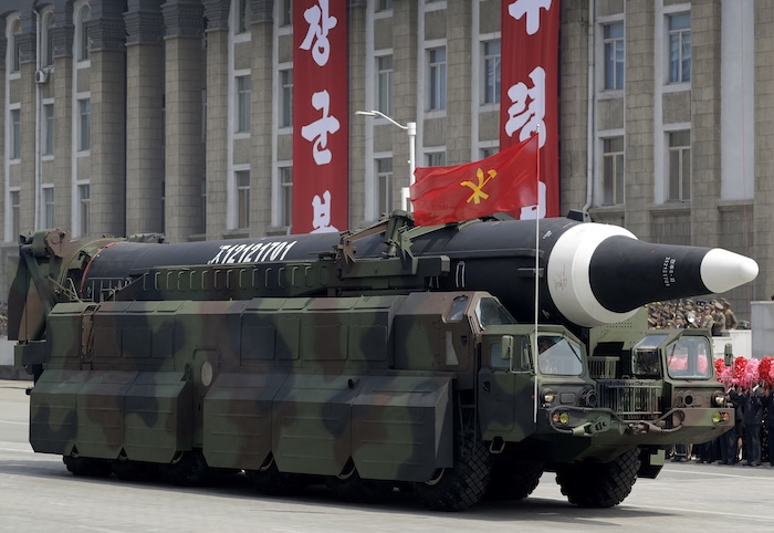 An unidentified missile that analysts believe could be the North Korean Hwasong-12 is paraded across Kim Il Sung Square