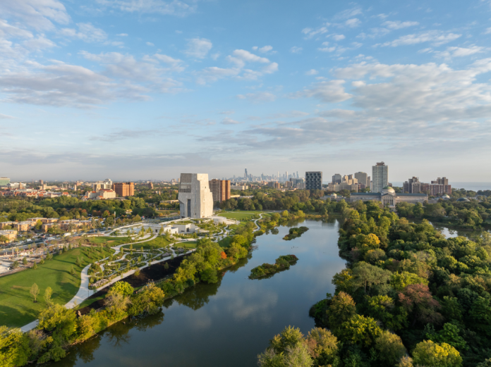 Aerial view of the Obama Presidential Library with the Chicago skyline in the background.