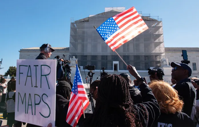 Voting rights activists gather outside the Supreme Court in Washington on Oct. 15, 2025, as the justices prepare to take up a major Republican-led challenge to the Voting Rights Act, the centerpiece legislation of the Civil Rights Movement. (Cliff Owen/AP)