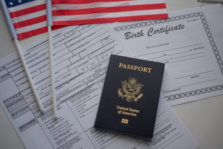 Certificate of live birth application form next to flag of USA.