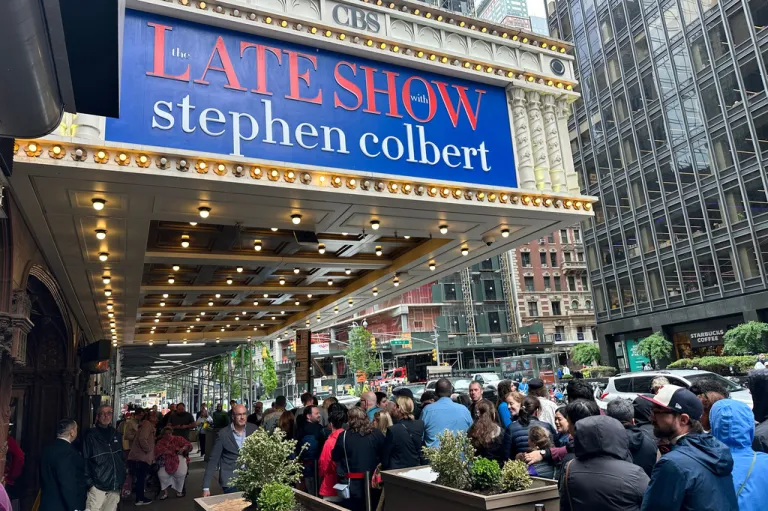 Fans line up in the rain outside the Ed Sullivan Theater in New York ahead of the final episode of 