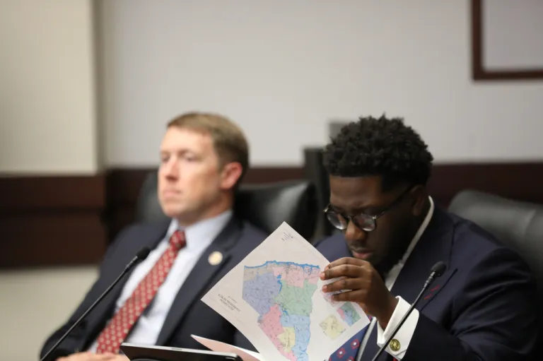 South Carolina Democratic Rep. Keishan Scott looks at a proposed U.S. House district map during a redistricting hearing in a state House Judiciary subcommittee.