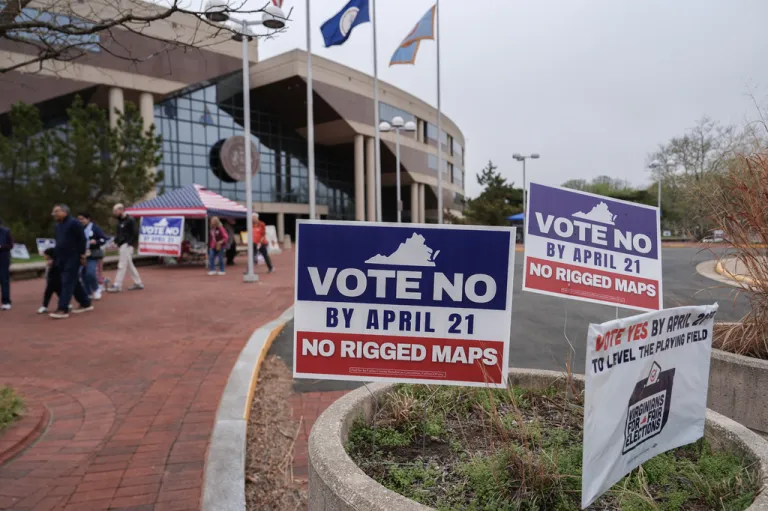 Voters walk outside the Fairfax County Government Center during early voting for the Virginia redistricting referendum.