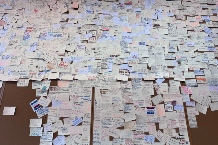 A wall of notes to Epstein survivors.