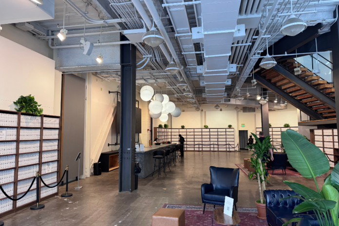 A room full of shelves with white files on them.