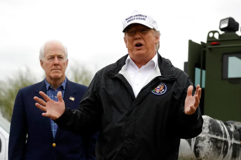President Donald Trump speaks as he tours the U.S. border with Mexico Thursday, Jan. 10, 2019, in McAllen, Texas, as Sen. John Cornyn (R-TX) listens. (AP Photo/ Evan Vucci)