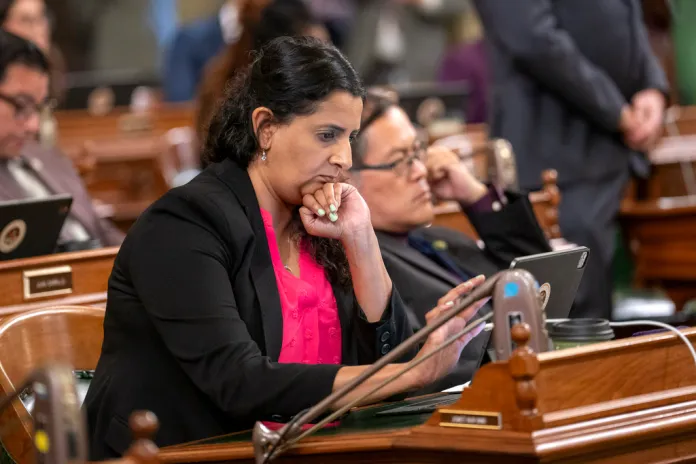 Assembly member Jasmeet Bain, D-Bakersfield, works at her desk at the Capitol in Sacramento, Calif., Tuesday, Sept.12, 2023. (AP Photo/Rich Pedroncelli)