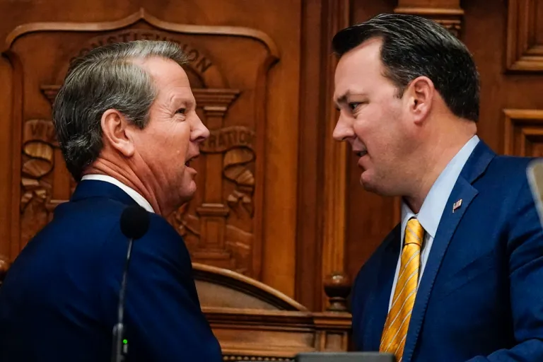 Georgia Gov. Brian Kemp, left, speaks with Lieutenant Governor Burt Jones before the State of the State speech, Thursday, Jan. 11, 2024, in Atlanta.