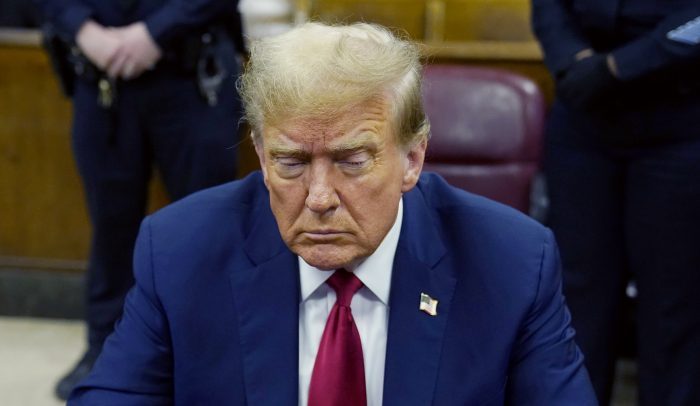 Then-former President Donald Trump attends his trial for covering up hush money payments linked to extramarital affairs, at Manhattan Criminal Court in New York City on April 23, 2024.